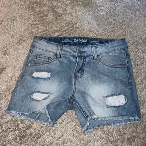 I’m selling jean shorts with white flower patches